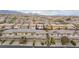 Aerial view of a neighborhood showcasing uniform rooftops and well-maintained landscaping at 10356 Addie De Mar Ln, Las Vegas, NV 89135