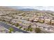 Neighborhood aerial shot showcasing similar rooftops, trees, and some solar panels in a residential setting at 10356 Addie De Mar Ln, Las Vegas, NV 89135