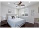 Inviting bedroom with stylish furniture, decor, ceiling fan, and natural light at 10356 Addie De Mar Ln, Las Vegas, NV 89135