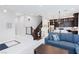 Open-concept living area showcasing a modern staircase, kitchen, dining, and living spaces at 10356 Addie De Mar Ln, Las Vegas, NV 89135