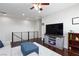 Upstairs loft area with hardwood floors, a television, and plenty of space for seating and relaxation at 10356 Addie De Mar Ln, Las Vegas, NV 89135