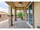 Covered patio with decorative brick pillars and an outdoor seating area at 10356 Addie De Mar Ln, Las Vegas, NV 89135
