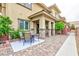 Outdoor patio with brick pillars, a table and chairs, and beautiful landscaping at 10356 Addie De Mar Ln, Las Vegas, NV 89135
