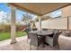 Covered patio with outdoor dining set, ideal for entertaining and enjoying outdoor meals at 10365 Cherokee Corner Ave, Las Vegas, NV 89129