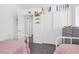This bedroom features neutral walls and carpet, with two white twin beds and closet at 10365 Cherokee Corner Ave, Las Vegas, NV 89129