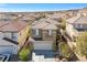Two-story home featuring a tile roof, solar panels, and a two-car garage in a well-kept neighborhood at 10365 Cherokee Corner Ave, Las Vegas, NV 89129