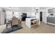 Bright kitchen with a center island and bar stool seating open to the dining area and decor at 10365 Cherokee Corner Ave, Las Vegas, NV 89129