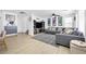 Cozy living room with modern decor, a comfortable couch, and wood-look floors at 10365 Cherokee Corner Ave, Las Vegas, NV 89129