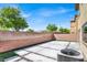 Beautiful backyard with concrete pavers, artificial turf, and brick walls at 10529 Mount Blackburn Ave, Las Vegas, NV 89166