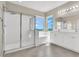 Bright bathroom featuring a glass-enclosed shower, soaking tub, and double sink vanity at 10529 Mount Blackburn Ave, Las Vegas, NV 89166