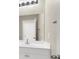 Bathroom features a white vanity with a bright mirror and modern fixtures at 10529 Mount Blackburn Ave, Las Vegas, NV 89166