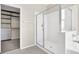 Modern bathroom showcasing a glass shower and an entrance to a walk-in closet at 10529 Mount Blackburn Ave, Las Vegas, NV 89166