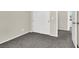 Carpeted bedroom with bi-fold closet doors and views of other rooms at 10529 Mount Blackburn Ave, Las Vegas, NV 89166