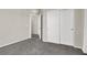 A carpeted bedroom with a closet, open door and neutral paint at 10529 Mount Blackburn Ave, Las Vegas, NV 89166