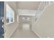 Bright foyer with tile flooring, leading to a spacious living area and staircase at 10529 Mount Blackburn Ave, Las Vegas, NV 89166