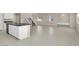 Open-concept kitchen and living space featuring tile flooring and modern appliances at 10529 Mount Blackburn Ave, Las Vegas, NV 89166