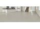Expansive open-concept living space with tile flooring and seamless flow to the kitchen at 10529 Mount Blackburn Ave, Las Vegas, NV 89166