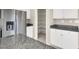 Kitchen features a stainless steel fridge and walk-in pantry with shelving at 10529 Mount Blackburn Ave, Las Vegas, NV 89166