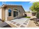 Charming backyard with a cozy patio, well-kept gravel, and partial artificial turf at 10540 Beachwalk Pl, Las Vegas, NV 89144