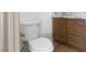 Contemporary bathroom featuring a toilet, and modern wooden cabinets at 10540 Beachwalk Pl, Las Vegas, NV 89144