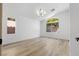 Bright bedroom featuring wood flooring, neutral walls, and ample natural light at 10540 Beachwalk Pl, Las Vegas, NV 89144