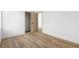 Bedroom featuring wood-look flooring and a walk-in closet at 10540 Beachwalk Pl, Las Vegas, NV 89144
