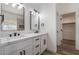 Bathroom with dual vanities featuring contemporary fixtures and ample cabinet space at 108 Appian Way, Henderson, NV 89002