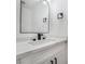 Modern bathroom featuring a sleek vanity with a stylish faucet and elegant mirror at 108 Appian Way, Henderson, NV 89002