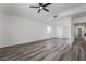 Expansive room featuring wood-look floors, ceiling fan, recessed lighting and a high vaulted ceiling at 108 Appian Way, Henderson, NV 89002