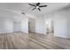 Open bedroom with ceiling fan, wood-look floors and an entryway into the bathroom at 108 Appian Way, Henderson, NV 89002