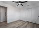 This bedroom boasts a ceiling fan, hardwood floors, and a closet for ample storage at 108 Appian Way, Henderson, NV 89002