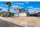 Well-maintained home exterior with a two-car garage, desert plants, and decorative gate at 108 Appian Way, Henderson, NV 89002