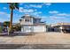 Two-story home featuring a spacious driveway, a two-car garage, and desert landscaping at 108 Appian Way, Henderson, NV 89002
