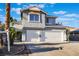 Two-story home showcasing a spacious driveway with a two-car garage and desert-friendly landscaping at 108 Appian Way, Henderson, NV 89002