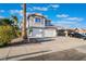 Charming two-story home with a spacious driveway, a two-car garage, and desert landscaping at 108 Appian Way, Henderson, NV 89002
