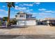 Two-story home featuring a spacious driveway, a two-car garage, and desert landscaping at 108 Appian Way, Henderson, NV 89002