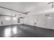 View of the spacious garage featuring epoxy flooring, ample lighting, and an abundance of storage space at 108 Appian Way, Henderson, NV 89002