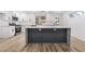 Contemporary kitchen with stainless appliances, expansive island, and modern cabinetry at 108 Appian Way, Henderson, NV 89002