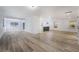 Bright open-concept living room with light hardwood floors and fresh white walls at 108 Appian Way, Henderson, NV 89002