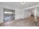 Open-concept living room featuring sleek floors and direct access to the outdoor pool area at 108 Appian Way, Henderson, NV 89002