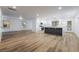 Bright, open living space featuring modern kitchen with island, sleek floors, and an airy atmosphere at 108 Appian Way, Henderson, NV 89002