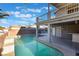 Backyard pool area with covered patio, upper deck, and mature landscaping offering a great space for outdoor living at 108 Appian Way, Henderson, NV 89002