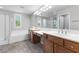 Elegant bathroom featuring double sinks, a soaking tub, and a separate shower at 11408 Newton Commons Dr # 104, Las Vegas, NV 89135