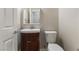 Cozy half bathroom featuring a vanity and a toilet, ideal for guests at 11408 Newton Commons Dr # 104, Las Vegas, NV 89135