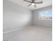 Neutral bedroom featuring plantation shutters, carpeted floor, and ceiling fan at 11408 Newton Commons Dr # 104, Las Vegas, NV 89135