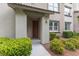 Charming home entrance with manicured bushes, creating an inviting curb appeal at 11408 Newton Commons Dr # 104, Las Vegas, NV 89135
