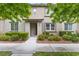 Charming two-story home with a landscaped yard featuring lush greenery and a welcoming entrance at 11408 Newton Commons Dr # 104, Las Vegas, NV 89135