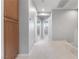 Hallway featuring neutral walls, carpeted floor, and doors to other rooms at 11408 Newton Commons Dr # 104, Las Vegas, NV 89135
