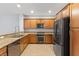 Modern kitchen with granite countertops, stainless steel appliances, and stylish wood cabinets at 11408 Newton Commons Dr # 104, Las Vegas, NV 89135