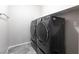 Bright laundry room featuring side-by-side washer and dryer with tile flooring at 11408 Newton Commons Dr # 104, Las Vegas, NV 89135
